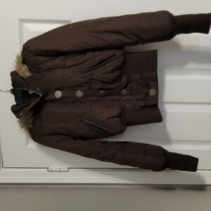 Max, brown jacket with fur hood